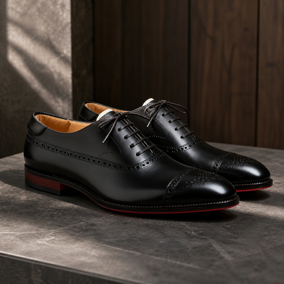 Black perforated cap toe Oxford shoes complete pair view — view 2
