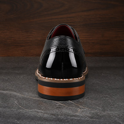 oxford shoes — Black wingtip Oxford shoe direct rear view — view 5