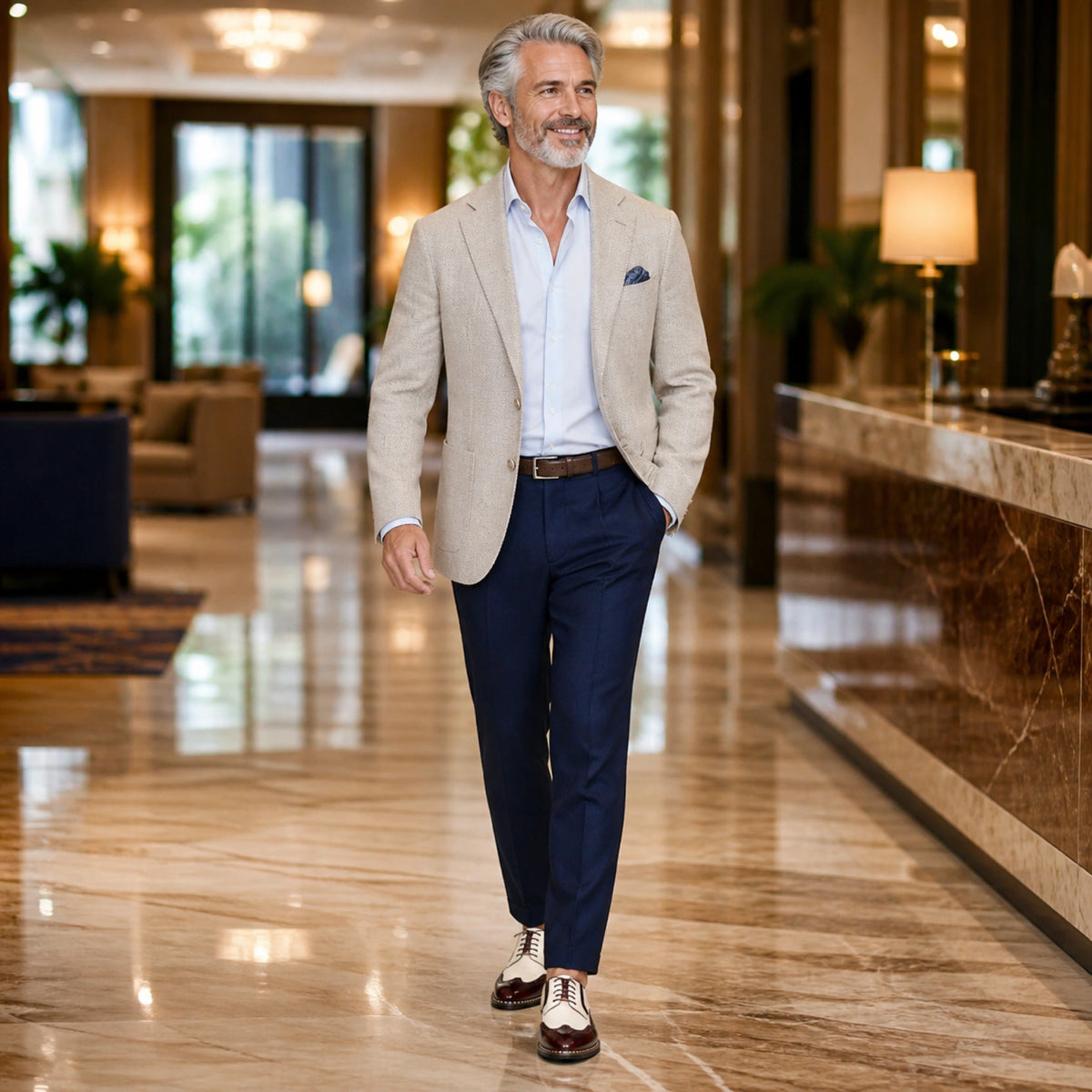 Mature man wearing cream and burgundy wingtip Oxford shoes in a hotel — view 7