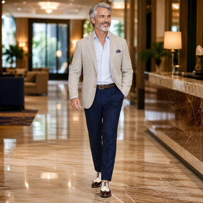 Mature man wearing cream and burgundy wingtip Oxford shoes in a hotel — view 7