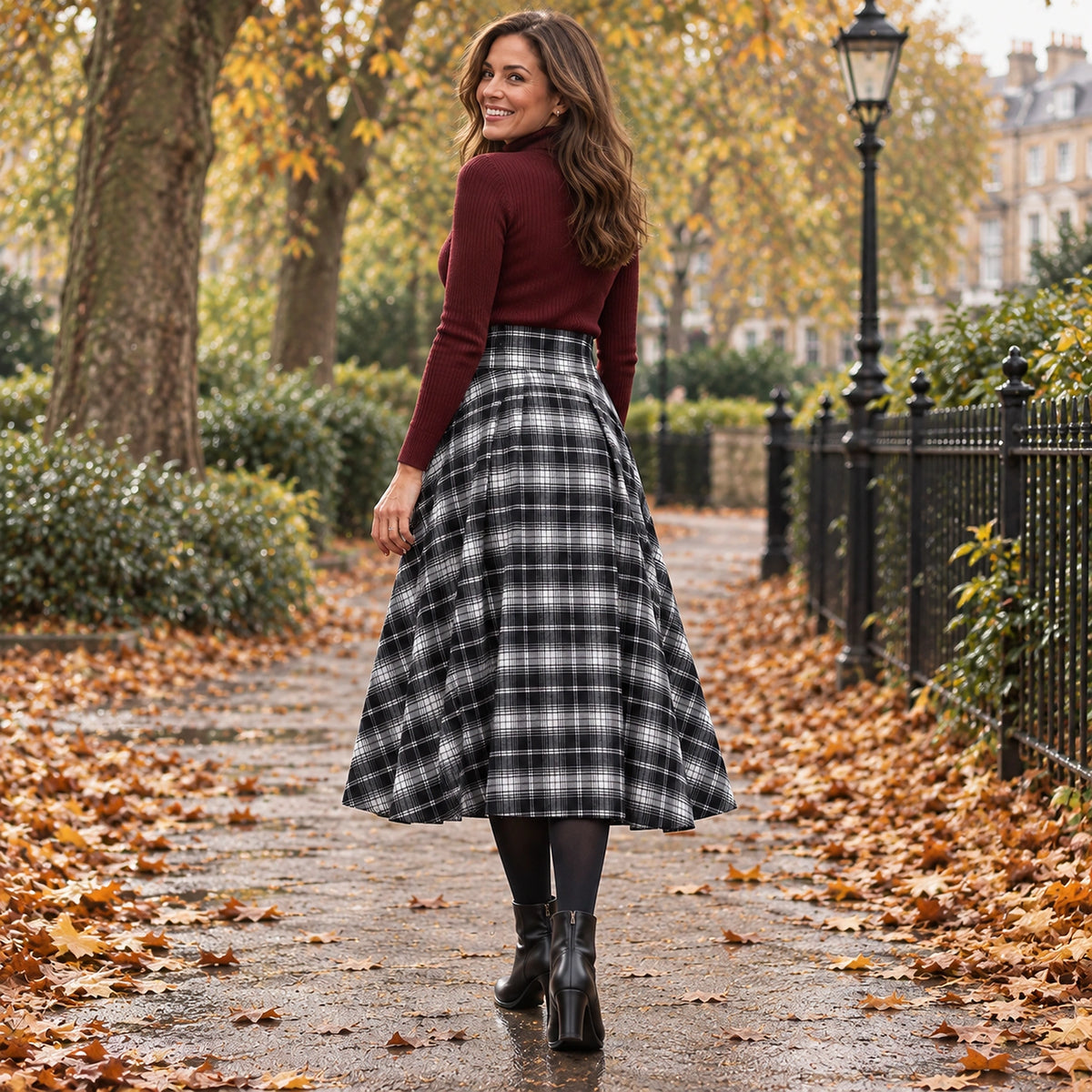 pleated skirt — Back full length view of the Black Plaid garment worn by a happy adult model in cool UK autumn — view 14