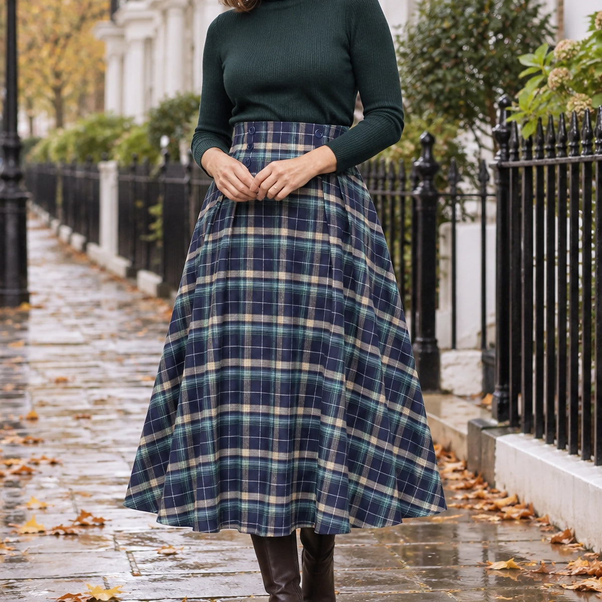 pleated skirt — Front view of the full Green blue Plaid skirt worn by an adult model in a cool UK autumn street — view 2