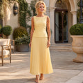 Butter yellow sleeveless shell and pleated skirt set complete front view