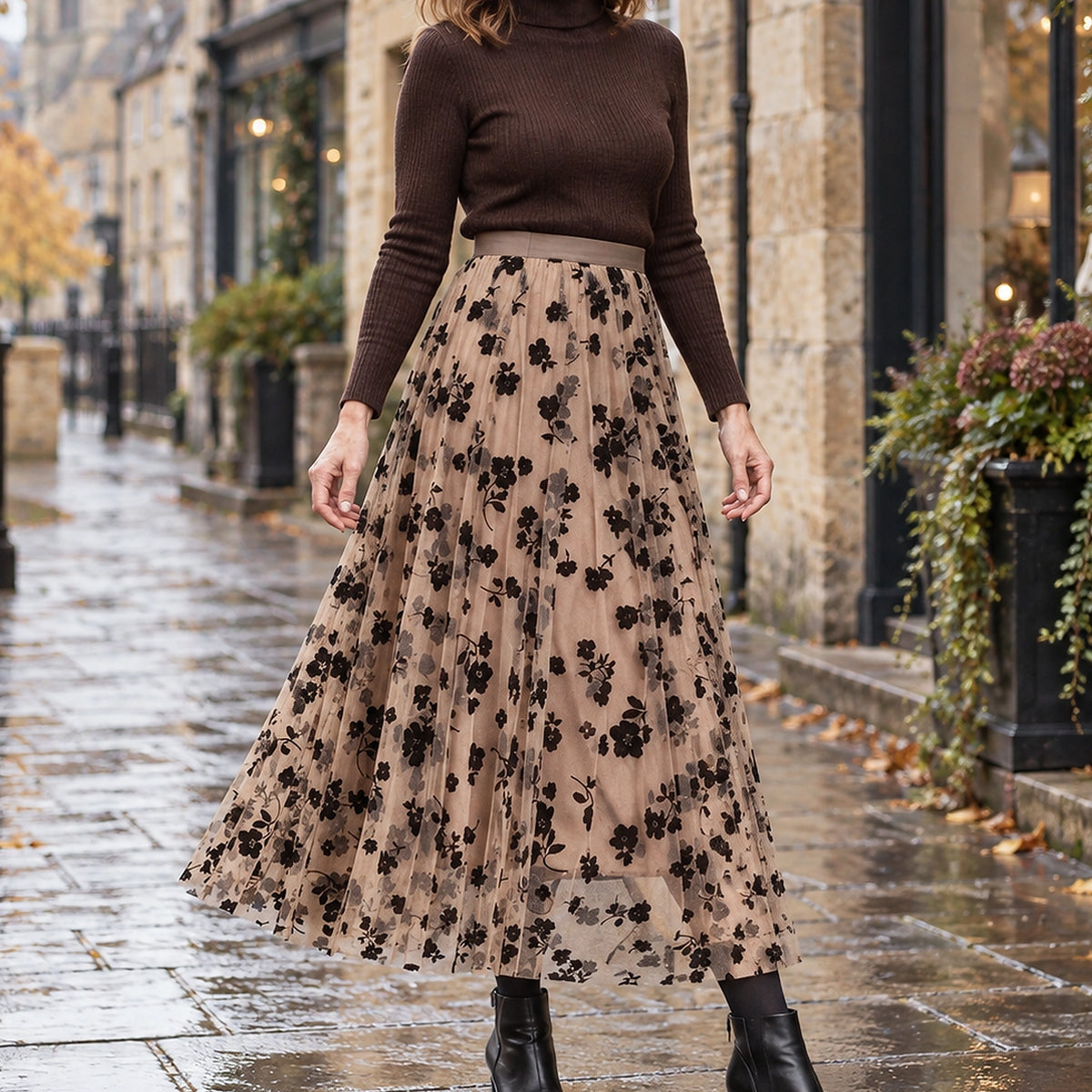 pleated skirt — Front view of the full Khaki skirt worn by an adult model in a cool UK autumn street setting