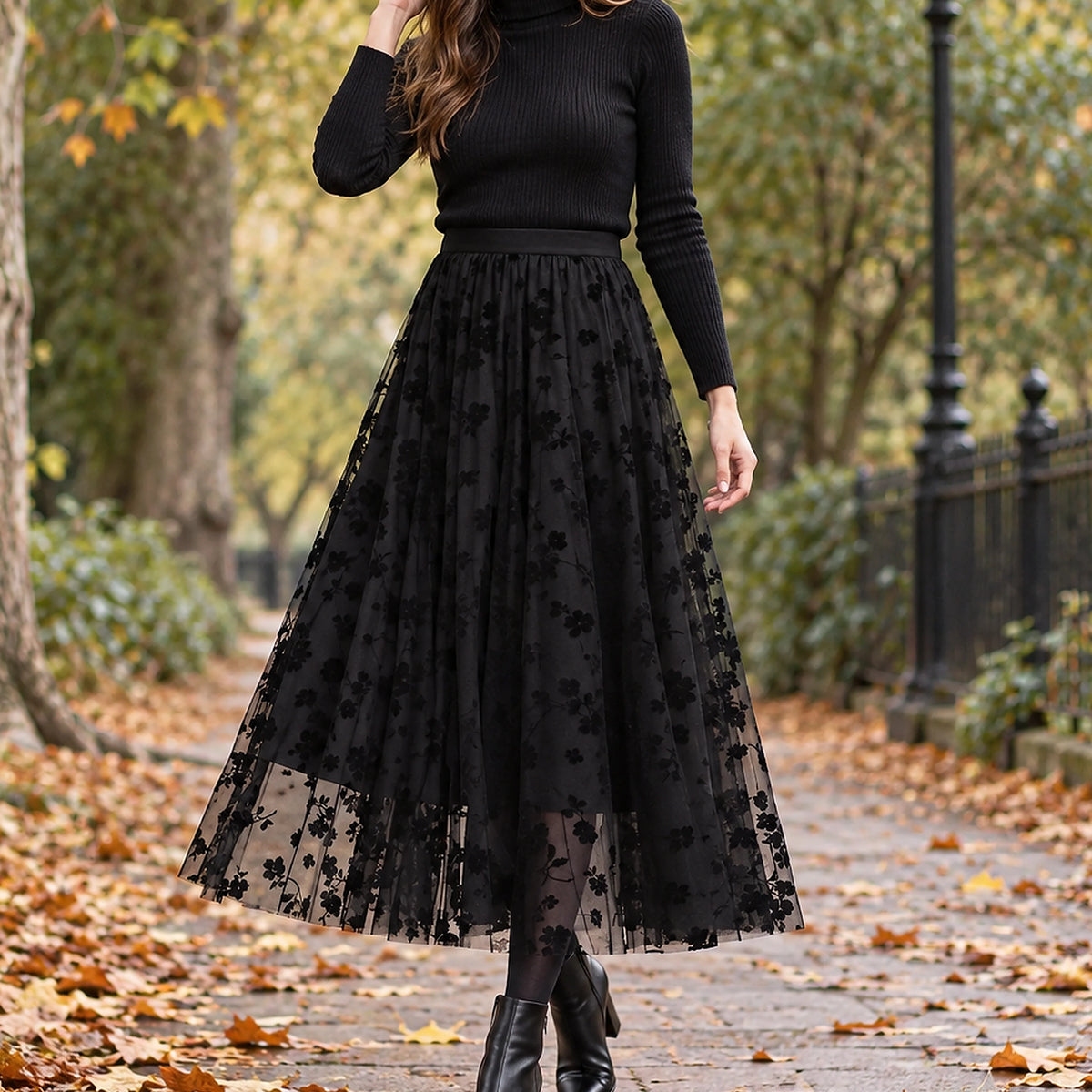 pleated skirt — Front view of the full Black skirt worn by an adult model in a cool UK autumn street setting — view 2