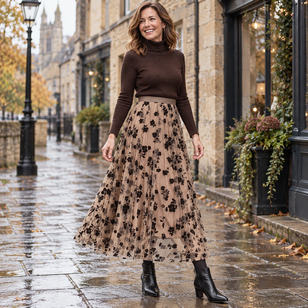 Happy adult model wearing the full Khaki Charlotte Floral High Waist A Line Mesh Pleated Skirt in cool UK autumn — view 4