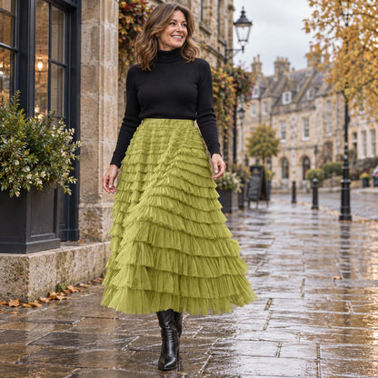 Front full length view of a happy model wearing the Green Chloe High Waisted Layered Ruffle and Lace Pleated Skirt — view 13