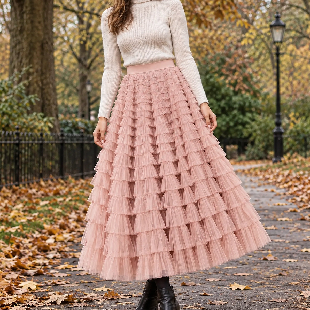 pleated skirt — Front view of the full Pink skirt worn by an adult model in a cool UK autumn street setting — view 3