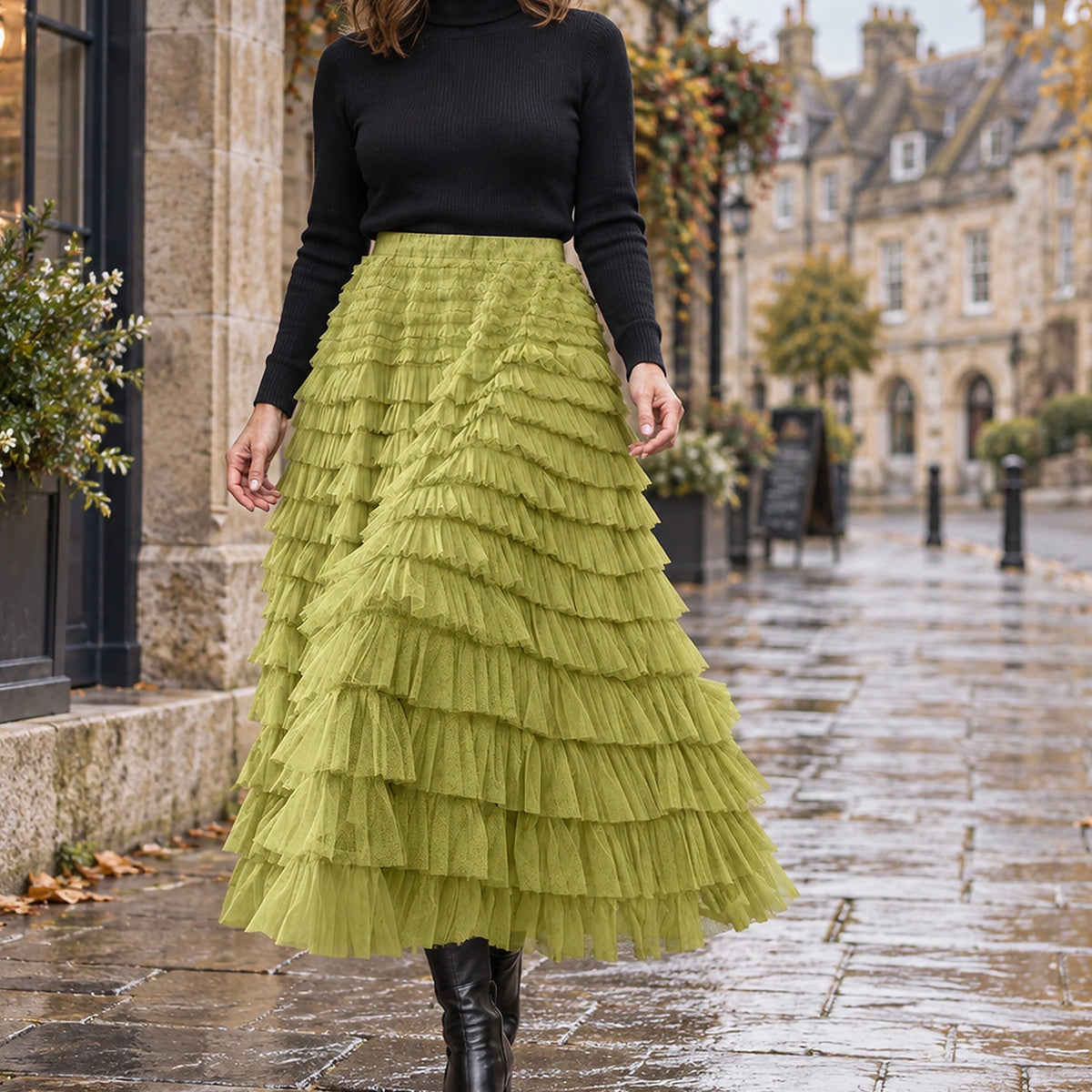 pleated skirt — Front view of the full Green skirt worn by an adult model in a cool UK autumn street setting — view 6