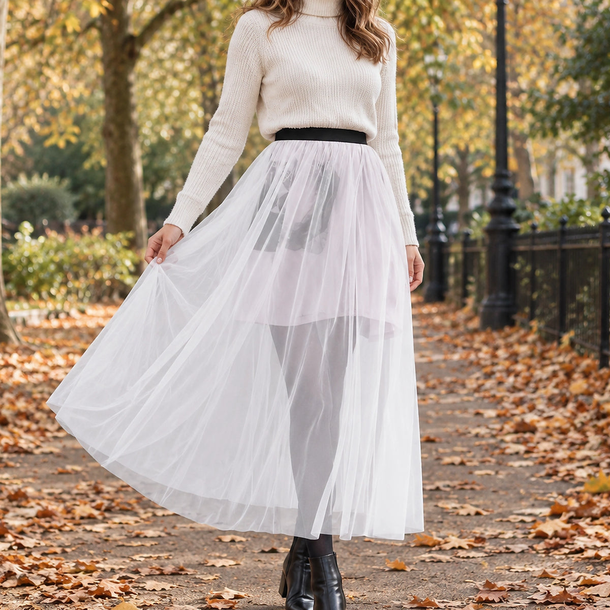 pleated skirt — Front view of the full Single layer White skirt worn by an adult model in a cool UK autumn street — view 7