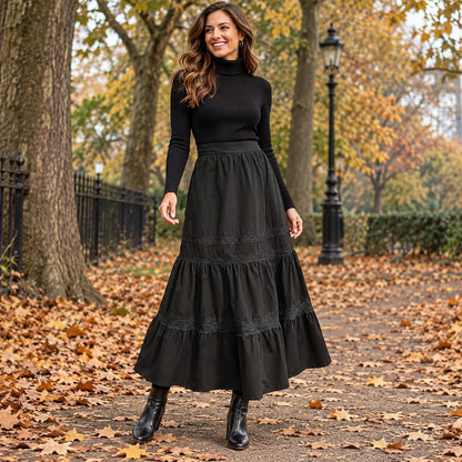 Happy adult model wearing the full Black Emma Green High Waist Lace Trim A Line Pleated Skirt in cool UK autumn — view 3