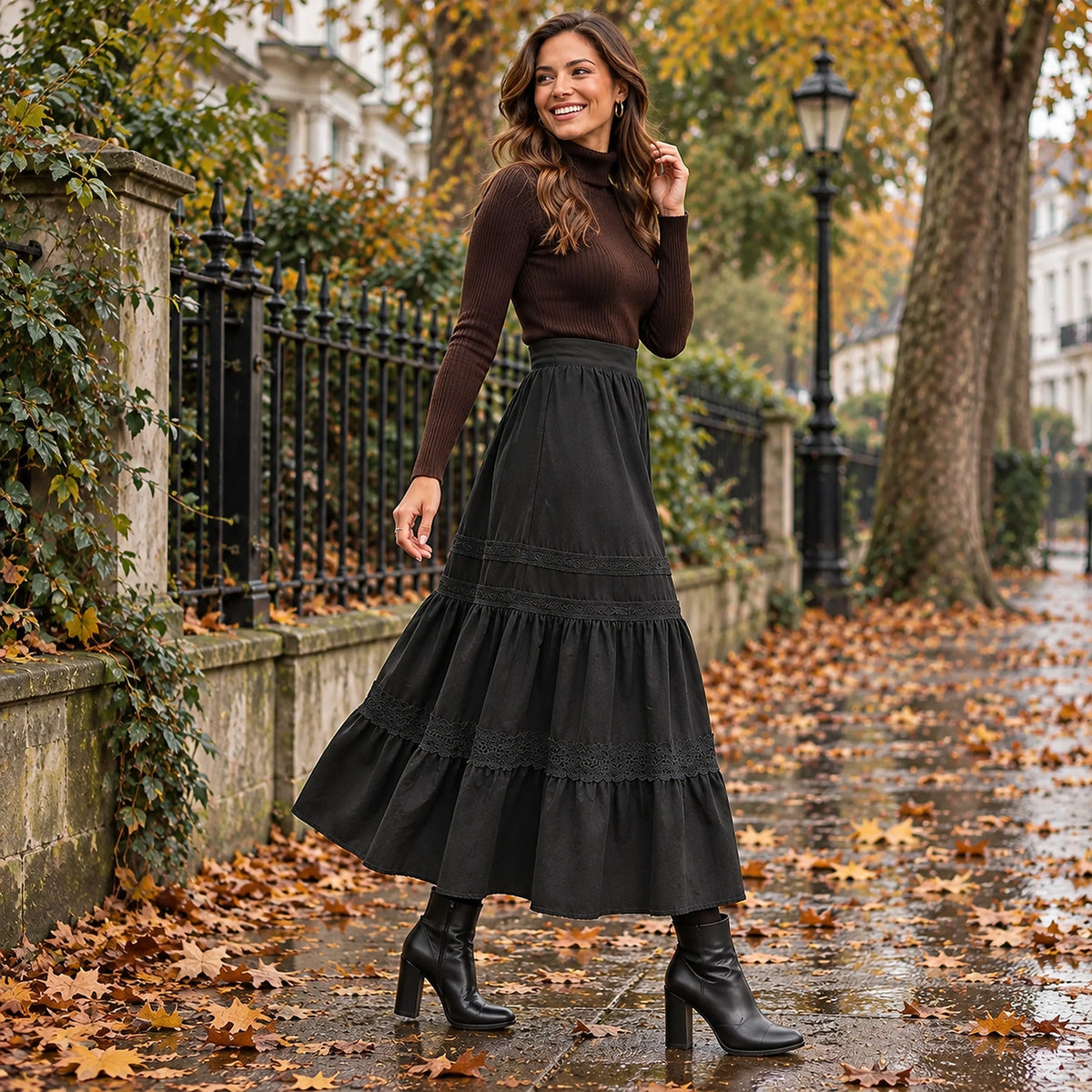 pleated skirt — Side full length view of the Black garment worn by a happy adult model in cool UK autumn setting — view 5