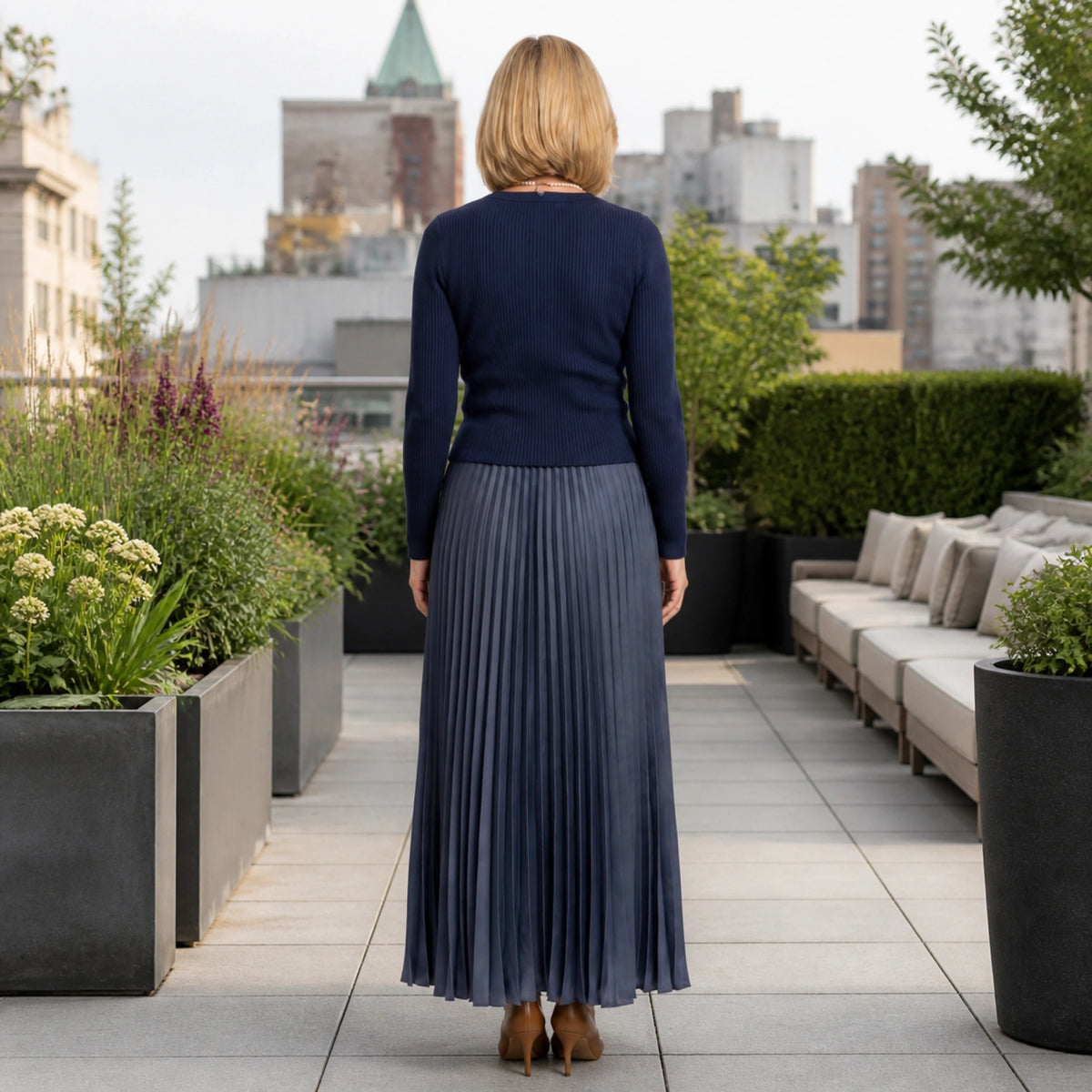 Navy blue knit top and pleated skirt set direct rear view — view 6