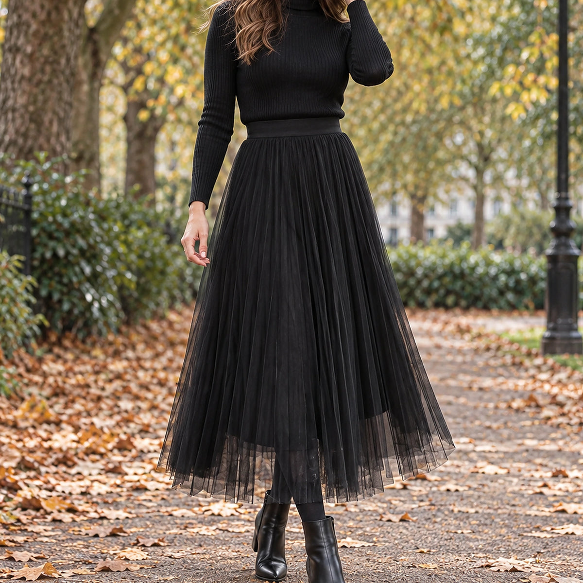 pleated skirt — Front view of the full Black skirt worn by an adult model in a cool UK autumn street setting — view 2
