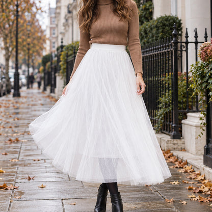 pleated skirt — Front view of the full White skirt worn by an adult model in a cool UK autumn street setting — view 4