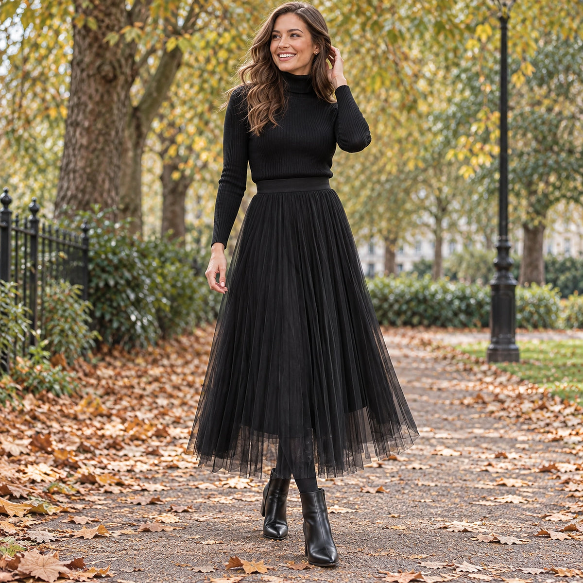 Front full length view of a happy model wearing the Black Hazel Floral Mesh High Waist Line Pleated Skirt in cool UK — view 6