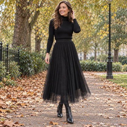 Front full length view of a happy model wearing the Black Hazel Floral Mesh High Waist Line Pleated Skirt in cool UK — view 6