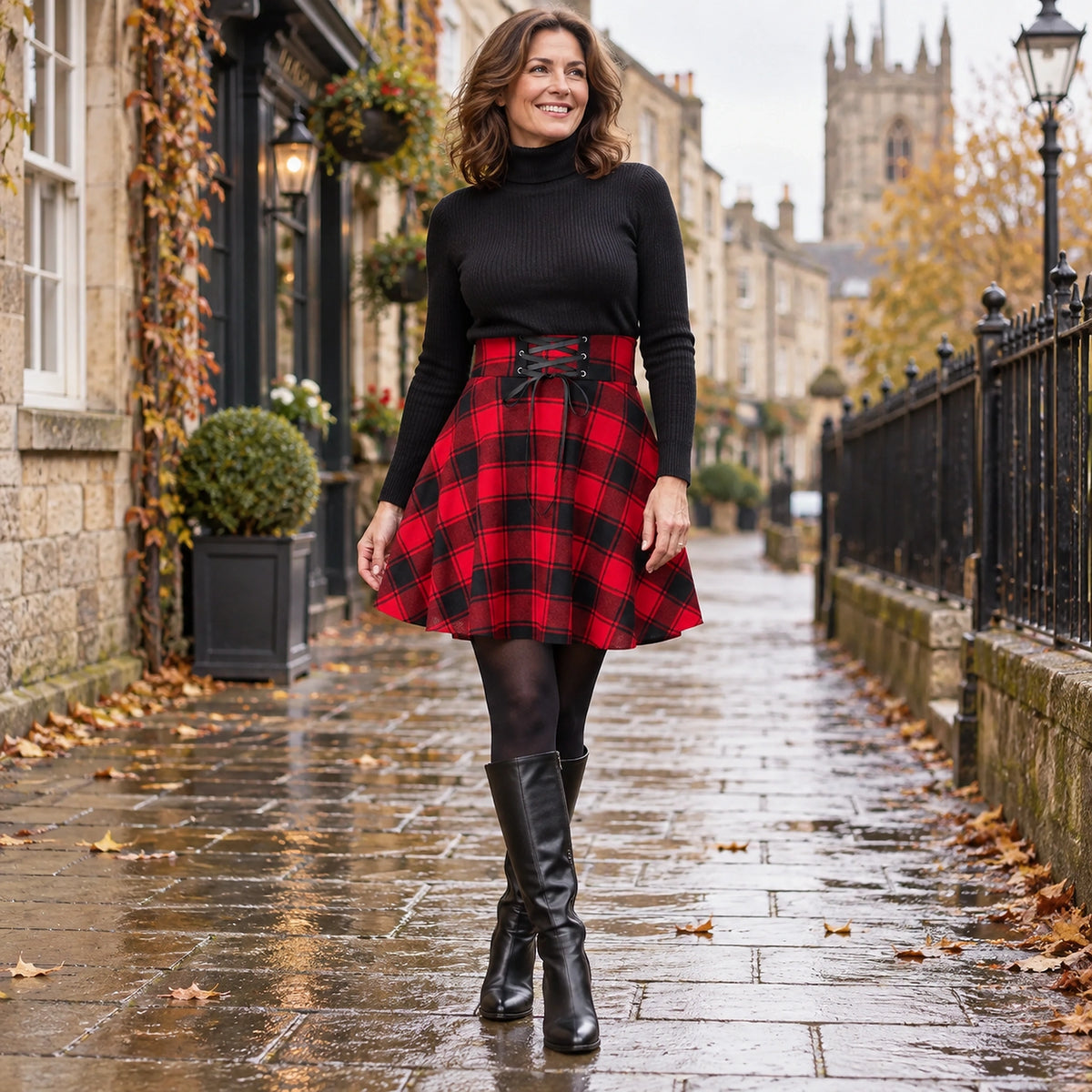Happy adult model wearing the full Red Lace up Plaid Hazel High Rise A Line Mini Pleated Skirt in cool UK autumn — view 14
