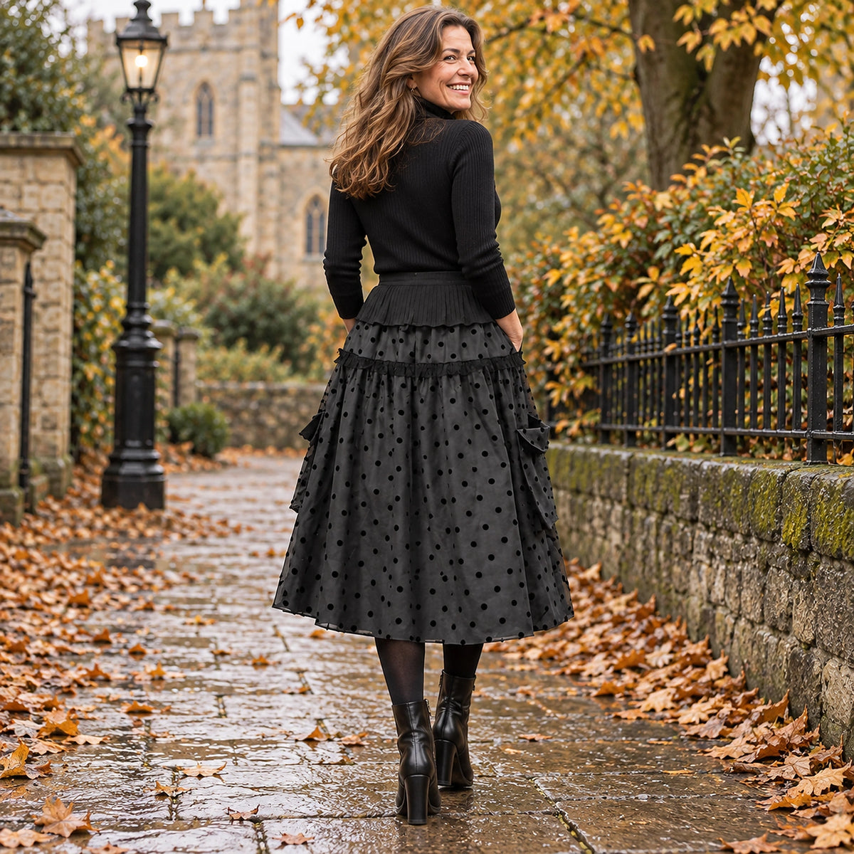 pleated skirt — Back full length view of the Black Ruffle garment worn by a happy adult model in cool UK autumn — view 8