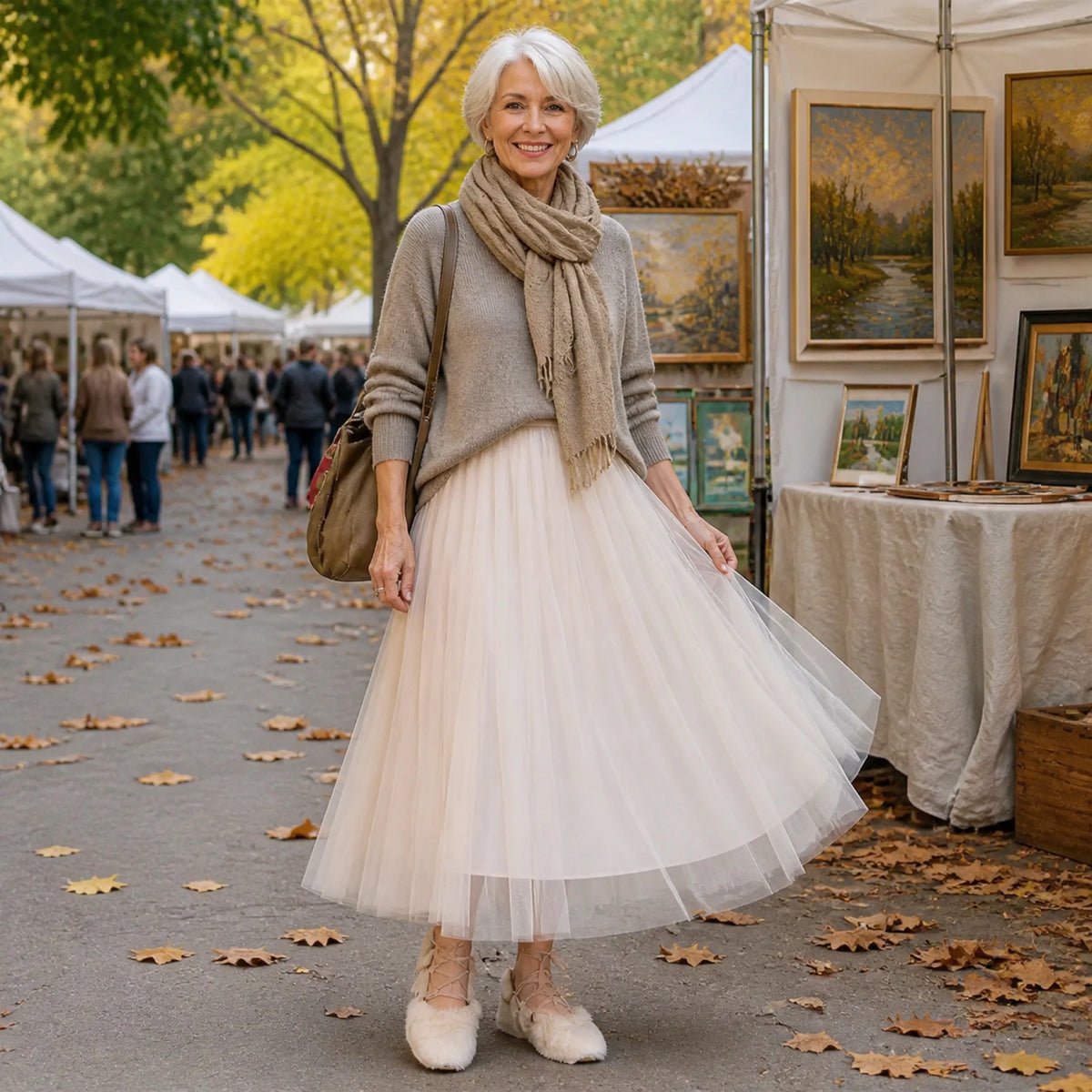 pleated skirt — Woman in her sixties wearing a champagne beige tulle skirt at an outdoor art fair — view 8