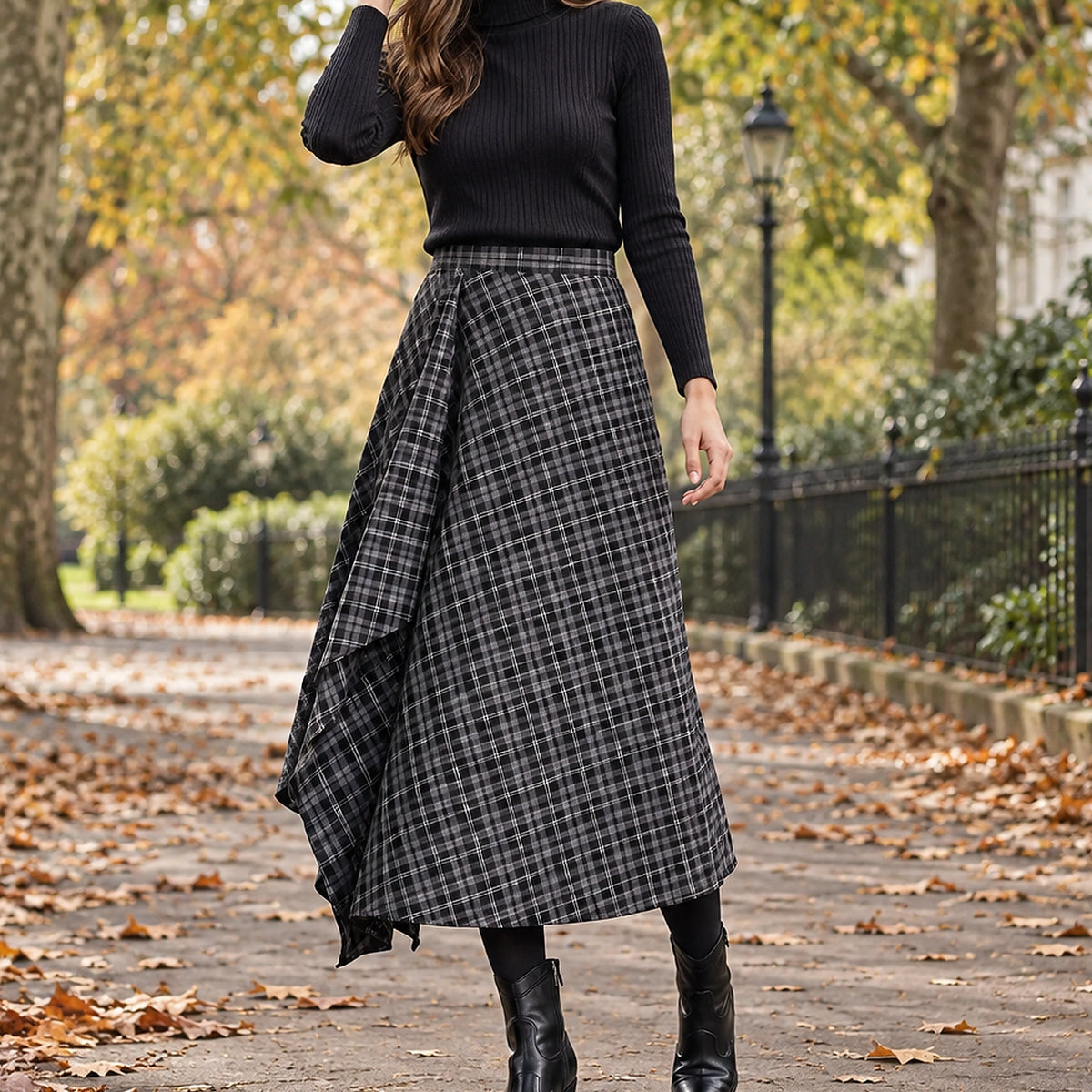 pleated skirt — Front view of the full Black skirt worn by an adult model in a cool UK autumn street setting
