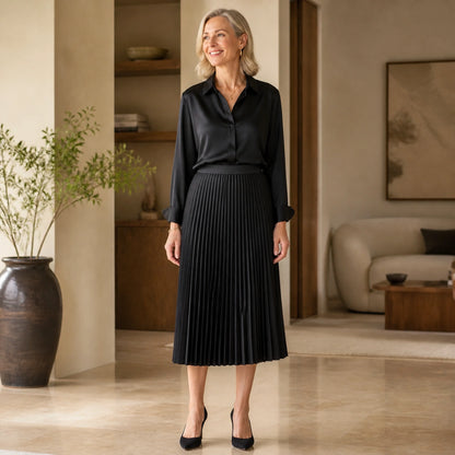 pleated skirt — Black satin accordion pleated midi skirt complete front view