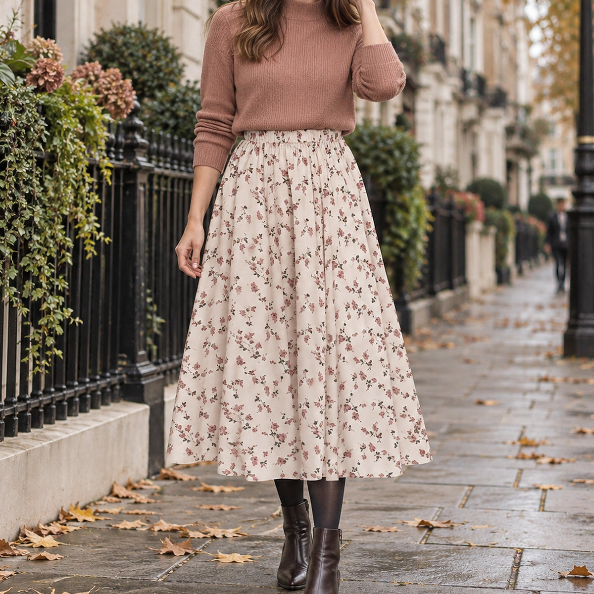 pleated skirt — Front view of the full Apricot Floral skirt worn by an adult model in a cool UK autumn street setting