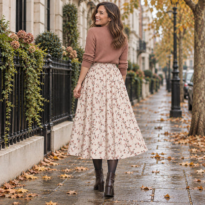 pleated skirt — Back full length view of the Apricot Floral garment worn by a happy adult model in cool UK autumn — view 12