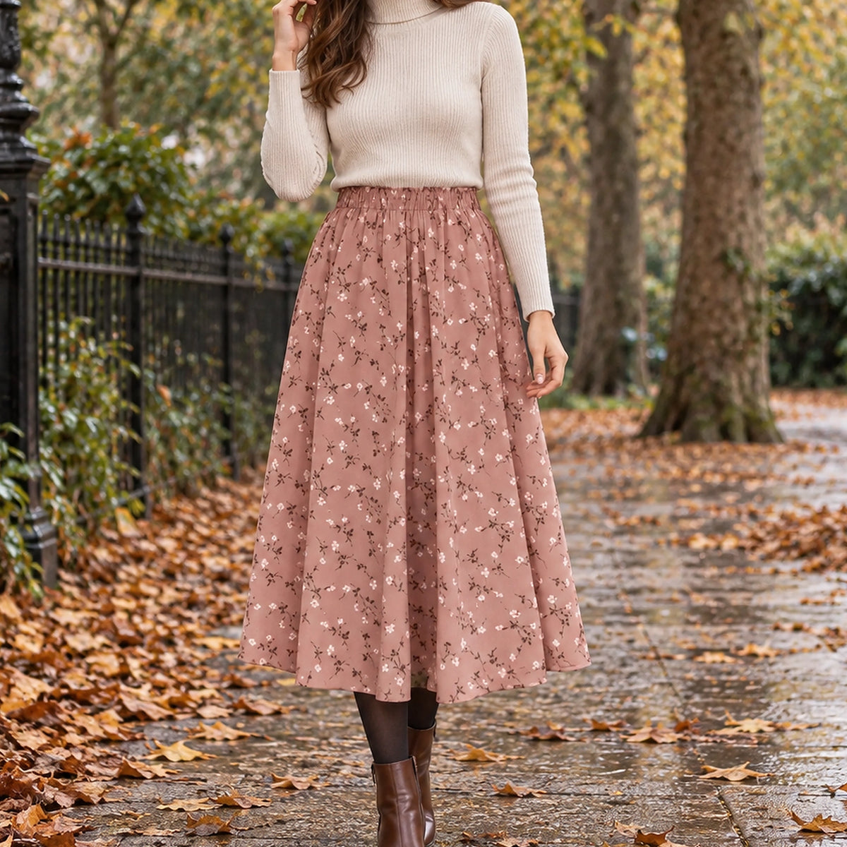 pleated skirt — Front view of the full Pink Floral skirt worn by an adult model in a cool UK autumn street setting — view 3