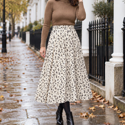 pleated skirt — Front view of the full White Floral skirt worn by an adult model in a cool UK autumn street setting — view 4