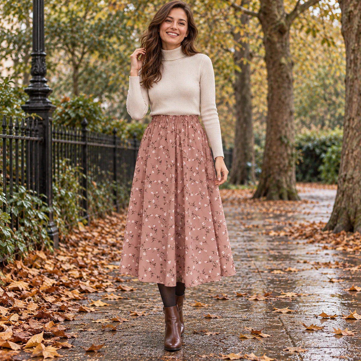 Happy adult model wearing the full Pink Floral Sophia A Line Midi with Elastic Waist Pleated Skirt in cool UK autumn — view 8