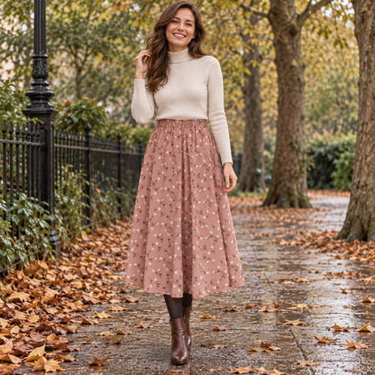 Happy adult model wearing the full Pink Floral Sophia A Line Midi with Elastic Waist Pleated Skirt in cool UK autumn — view 8