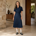 pleated skirt — Denim blue tailored pleated midi skirt complete front view