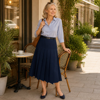 pleated skirt — Woman wearing a navy pleated midi skirt at an outdoor cafe — view 8