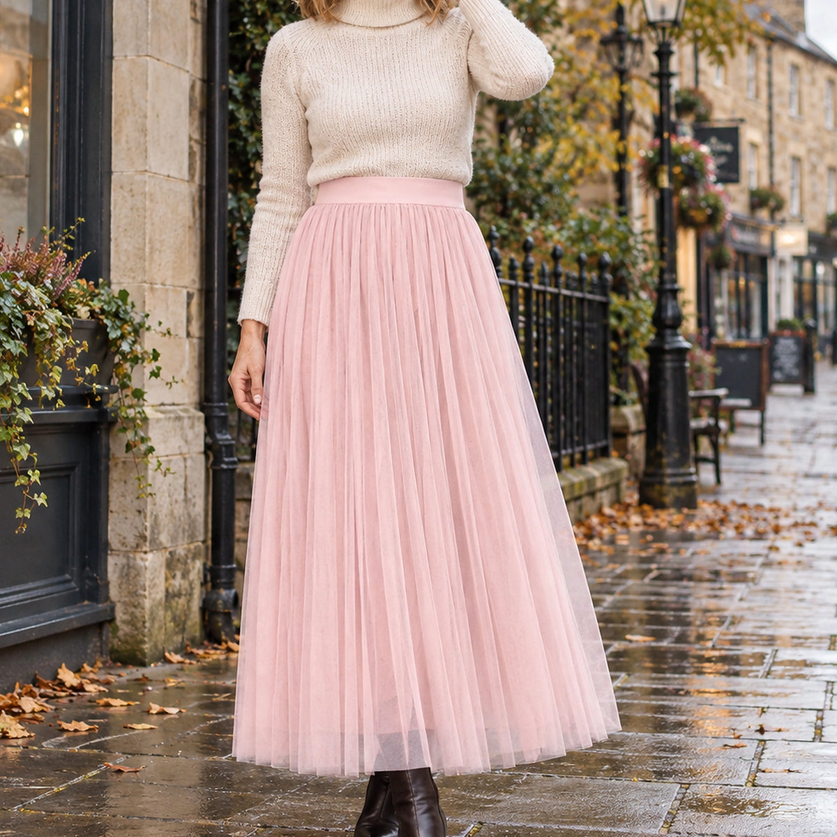 pleated skirt — Front view of the full Pink 98 cm skirt worn by an adult model in a cool UK autumn street setting — view 16