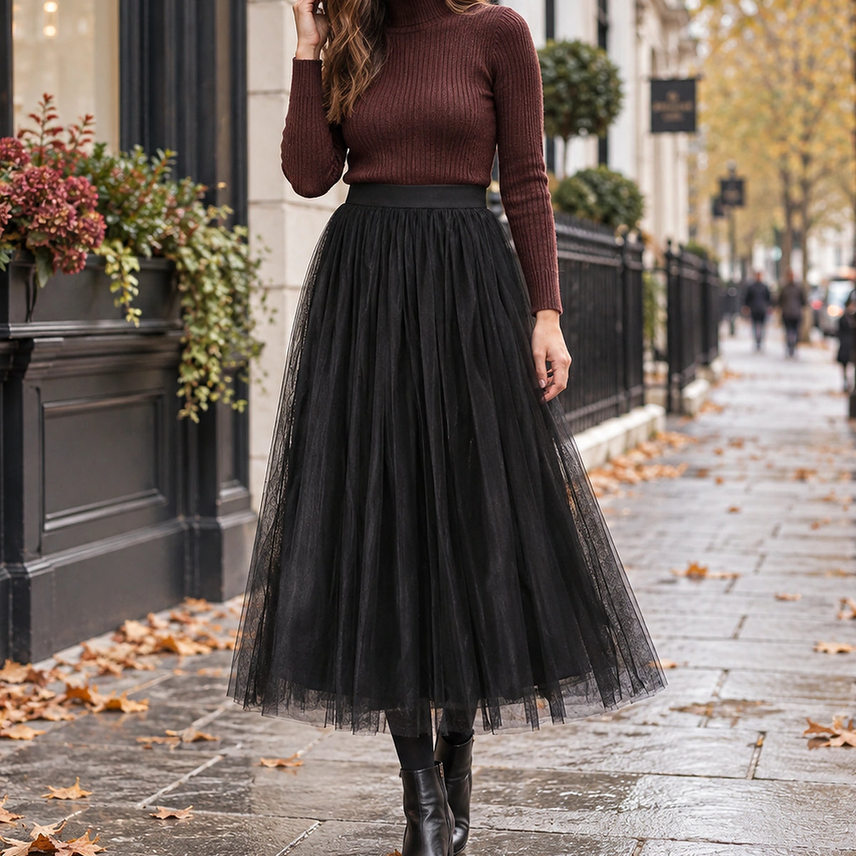 pleated skirt — Front view of the full Black 88 cm skirt worn by an adult model in a cool UK autumn street setting — view 19