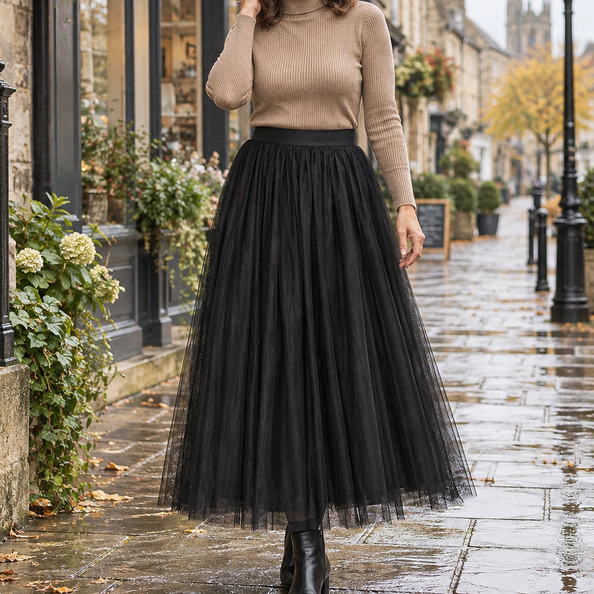 pleated skirt — Front view of the full Black 98 cm skirt worn by an adult model in a cool UK autumn street setting — view 20