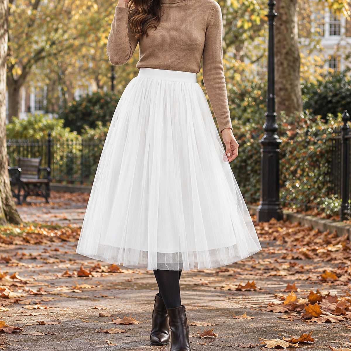 pleated skirt — Front view of the full White 68 cm skirt worn by an adult model in a cool UK autumn street setting — view 21
