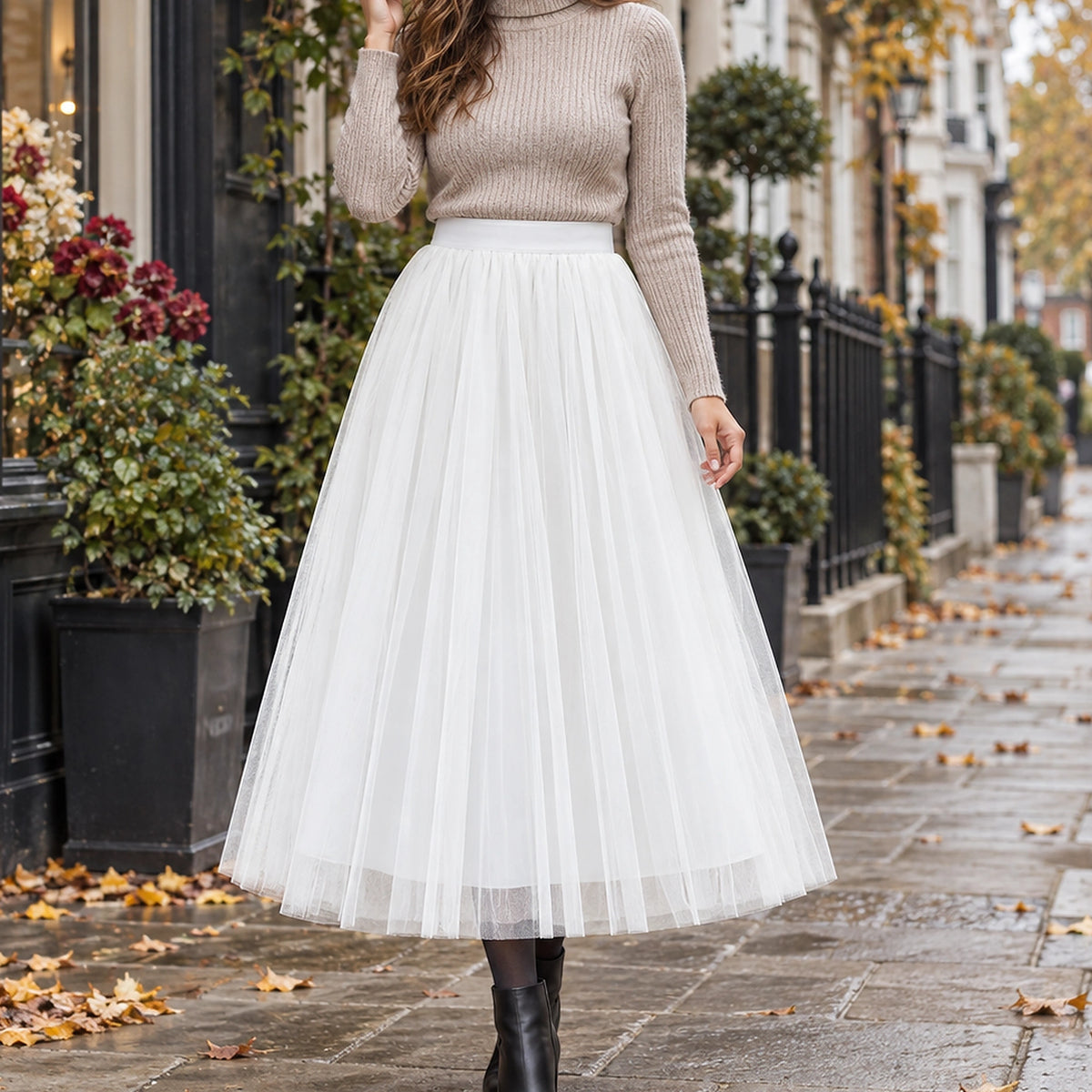 pleated skirt — Front view of the full White 88 cm skirt worn by an adult model in a cool UK autumn street setting — view 23