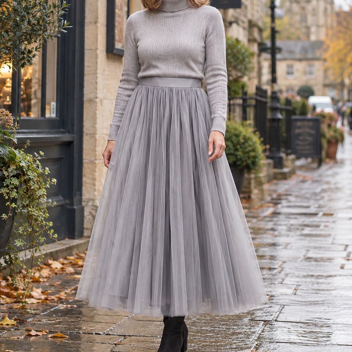 pleated skirt — Front view of the full Grey 98 cm skirt worn by an adult model in a cool UK autumn street setting — view 28