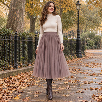 Happy adult model wearing the full Coffee Violet High Waisted A Line Tulle Pleated Skirt in cool UK autumn setting — view 29