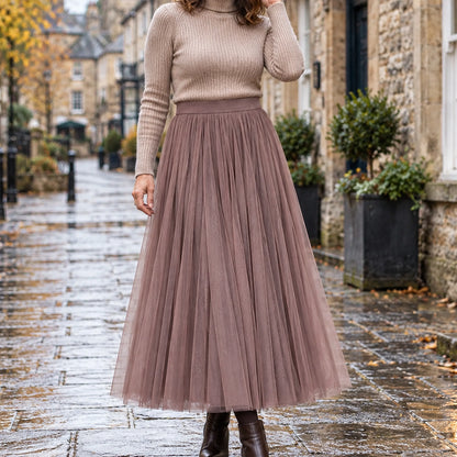 pleated skirt — Front view of the full Coffee 98 cm skirt worn by an adult model in a cool UK autumn street setting — view 4