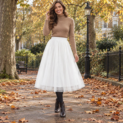 Happy adult model wearing the full White Violet High Waisted A Line Tulle Pleated Skirt in cool UK autumn setting — view 49