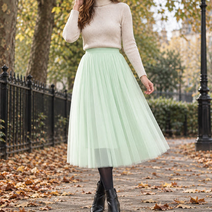 pleated skirt — Front view of the full Green 68 cm skirt worn by an adult model in a cool UK autumn street setting — view 5