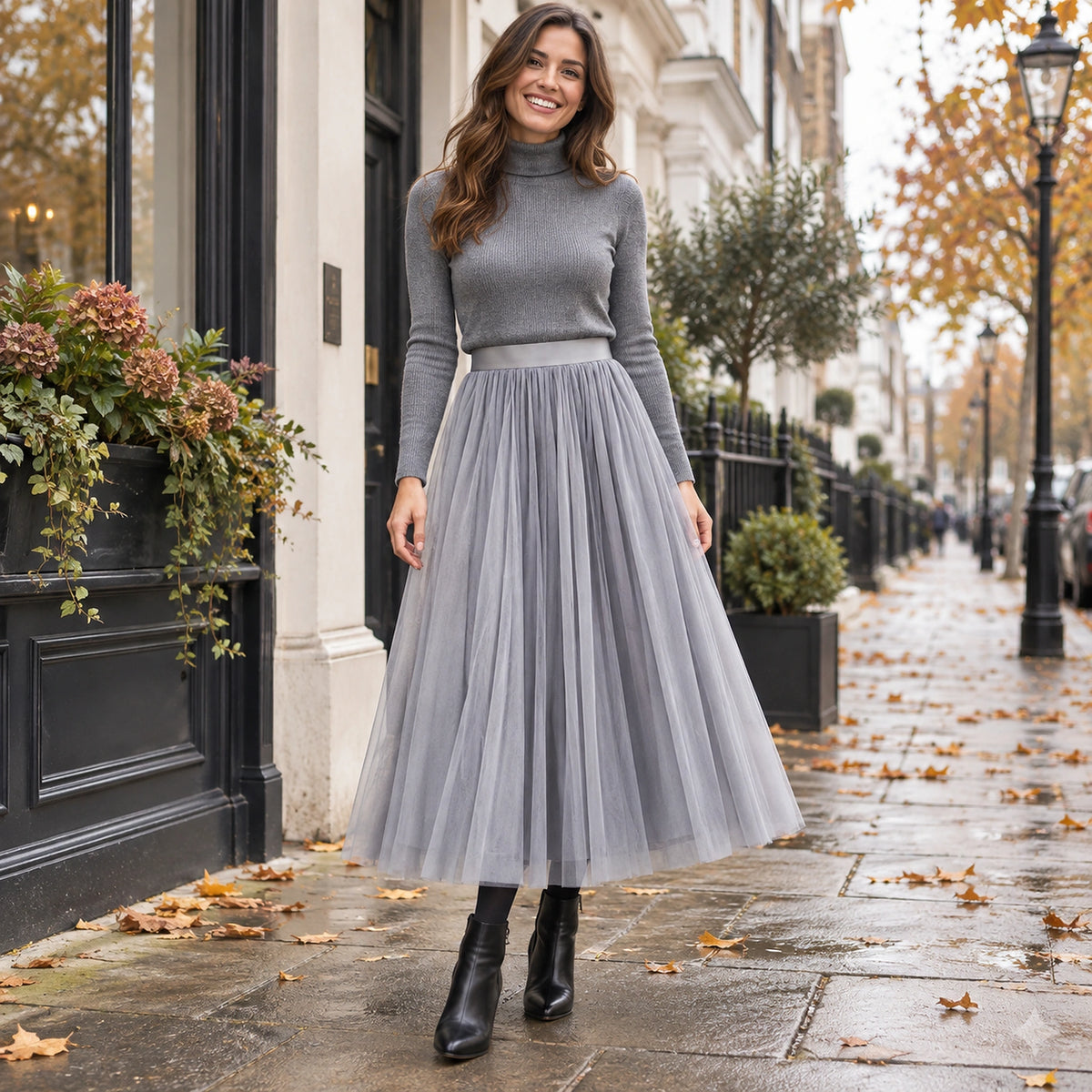 Happy adult model wearing the full Grey Violet High Waisted A Line Tulle Pleated Skirt in cool UK autumn setting — view 55