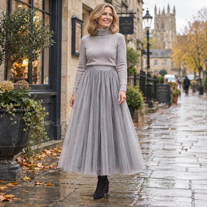 Happy adult model wearing the full Grey Violet High Waisted A Line Tulle Pleated Skirt in cool UK autumn setting — view 56