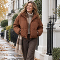 puffer jacket — Jacket focused front view of the full Brown Isabella Cropped Stand Collar Drawcord Puffer worn by a happy
