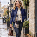 puffer jacket — Jacket focused front view of the full Navy Blue Ruby Cropped Teddy Lined Quilted Puffer worn by a happy adult