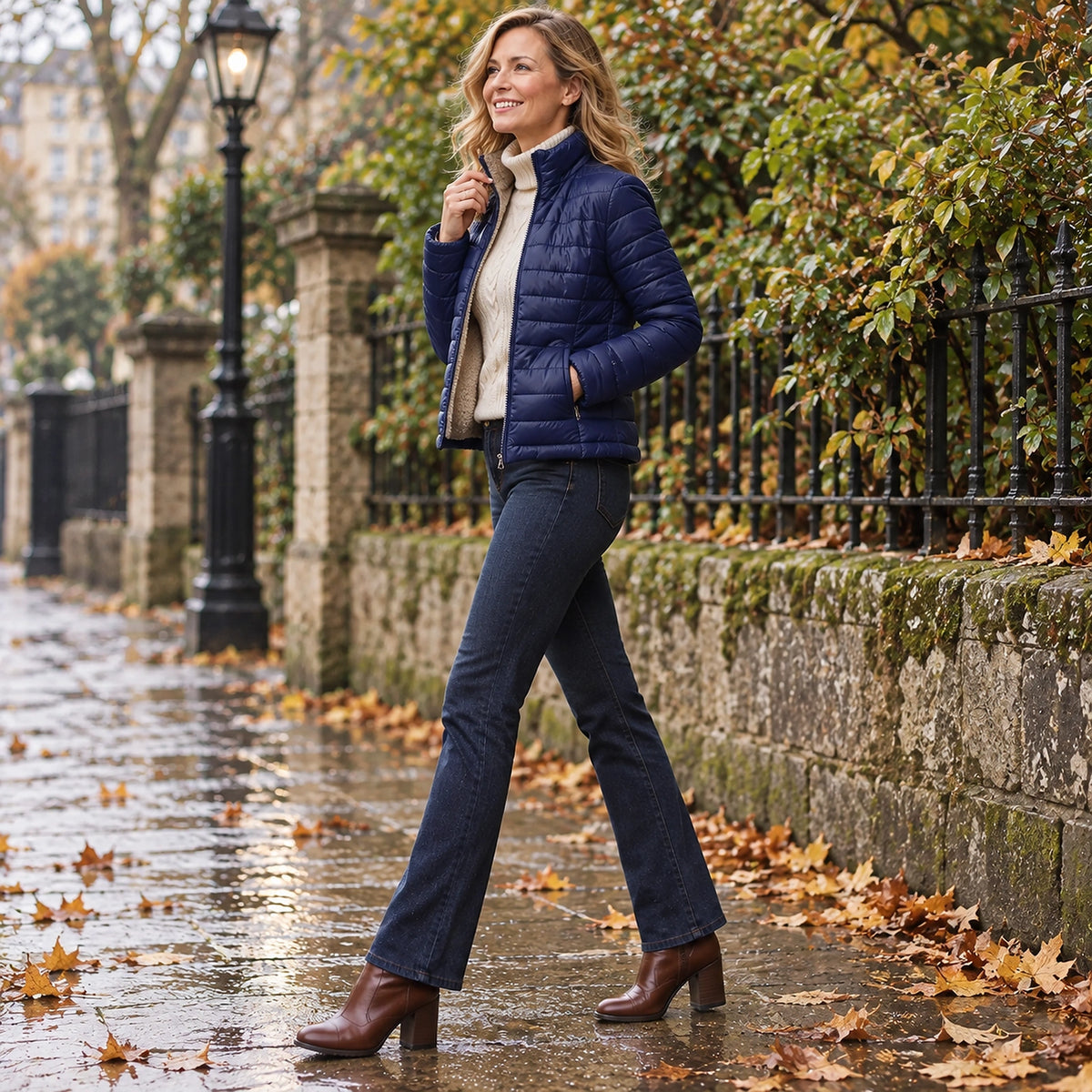 puffer jacket — Side full length view of the Navy Blue garment worn by a happy adult model in cool UK autumn setting — view 5