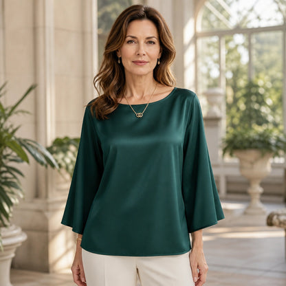 Emerald green relaxed three quarter sleeve satin blouse complete front view